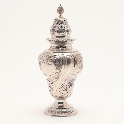 123 - AN EDWARDIAN SILVER SUGAR CASTER. vase-shaped, with a pull-off cover and embossed & chased decoratio... 