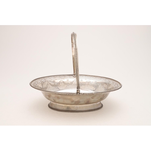 125 - A GEORGE III SILVER SWING-HANDLE CAKE BASKET. oval outline, with bead borders, the edges and foot wi... 