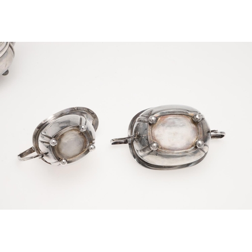 131 - AN EDWARDIAN SMALL OR BACHELOR'S THREE PIECE SILVER TEA SET. rounded rectangular, with gadrooned bor... 