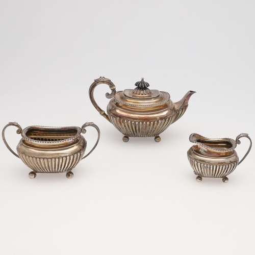 133 - A LATE VICTORIAN SMALL OR BACHELOR'S THREE-PIECE SILVER TEA SET. rounded rectangular, with tongue & ... 