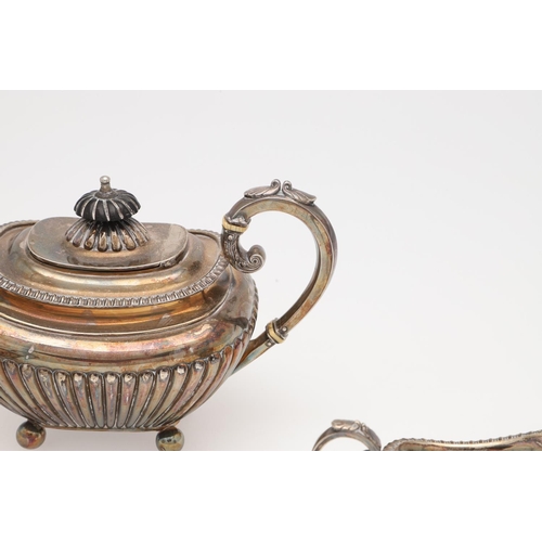 133 - A LATE VICTORIAN SMALL OR BACHELOR'S THREE-PIECE SILVER TEA SET. rounded rectangular, with tongue & ... 