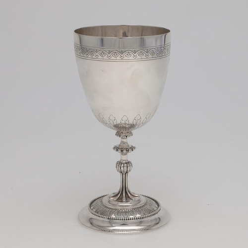 134 - A VICTORIAN SILVER WINE GOBLET. with a knopped stem, bead borders, a chased frieze and a chased caly... 