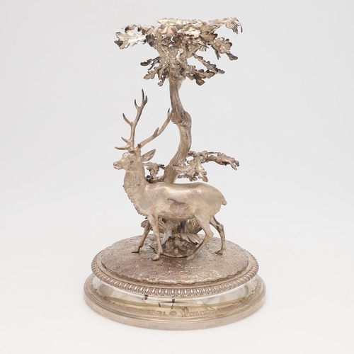 135 - A VICTORIAN SILVER PRESENTATION CENTREPIECE. the naturalistic scene in the form of a deer underneath... 