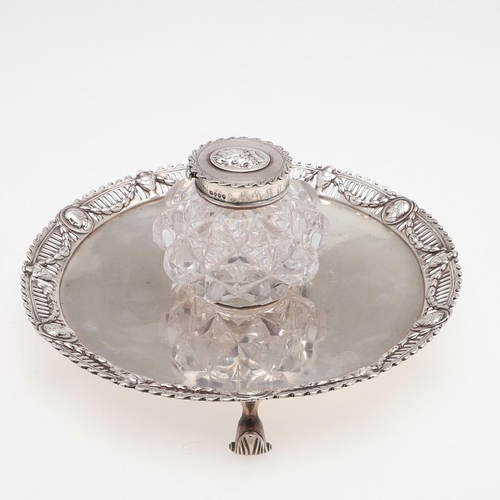 136 - A VICTORIAN SILVER INKSTAND. circular outline, the applied border with alternating masks intersperse... 