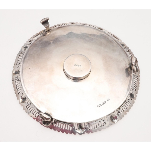 136 - A VICTORIAN SILVER INKSTAND. circular outline, the applied border with alternating masks intersperse... 