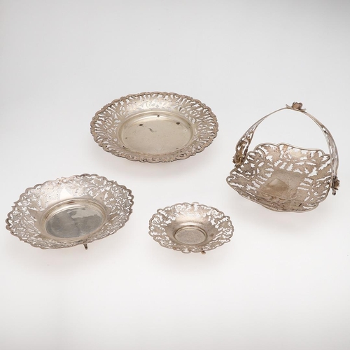 137 - 20TH CENTURY EGYPTIAN SILVER. three dishes & a swing-handle basket, all with pierced floral decorati... 