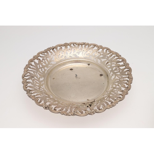 137 - 20TH CENTURY EGYPTIAN SILVER. three dishes & a swing-handle basket, all with pierced floral decorati... 