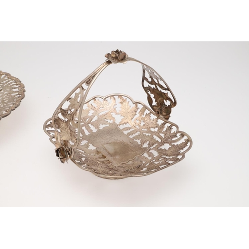 137 - 20TH CENTURY EGYPTIAN SILVER. three dishes & a swing-handle basket, all with pierced floral decorati... 