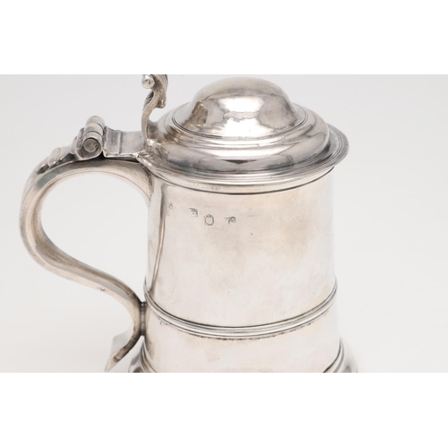 143 - A GEORGE II LADY'S SILVER TANKARD. tapering circular form, with an applied moulded girdle, a scroll ... 