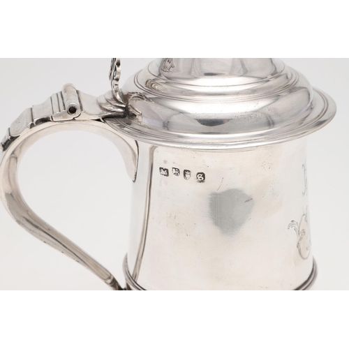 144 - A GEORGE III TAPERING SILVER TANKARD. circular, with an applied moulded girdle, an 'S'-scroll handle... 