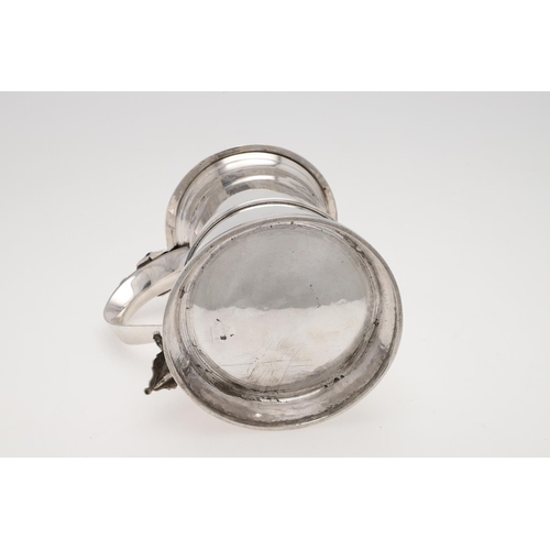 144 - A GEORGE III TAPERING SILVER TANKARD. circular, with an applied moulded girdle, an 'S'-scroll handle... 