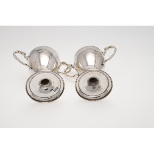 149 - A PAIR OF GEORGE III IRISH SILVER TWO-HANDLED CUPS. campana form, with twin scroll handles, an engra... 