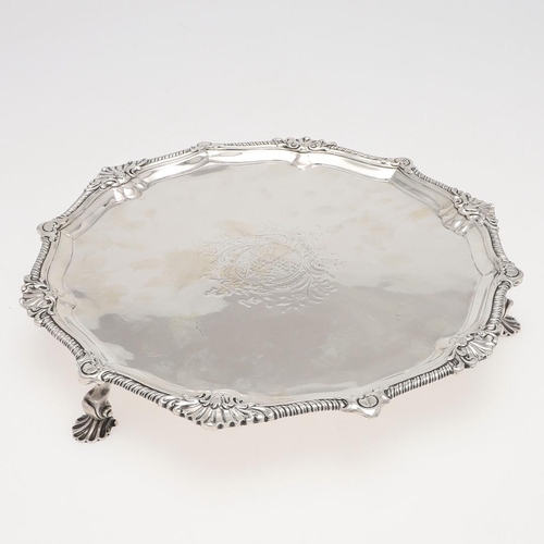 156 - A GEORGE III IRISH SILVER SALVER. shaped circular outline, with alternating shell motifs, an engrave... 