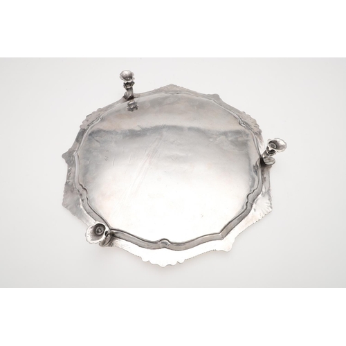 156 - A GEORGE III IRISH SILVER SALVER. shaped circular outline, with alternating shell motifs, an engrave... 