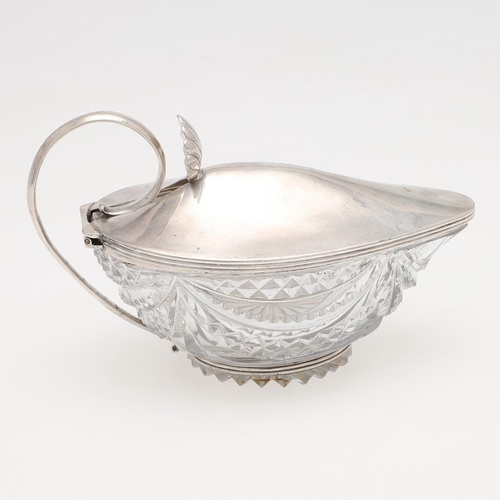 157 - A GEORGE III SILVER MOUNTED CUT-GLASS JUG. with reeded borders, a scroll handle and a shell thumbpie... 