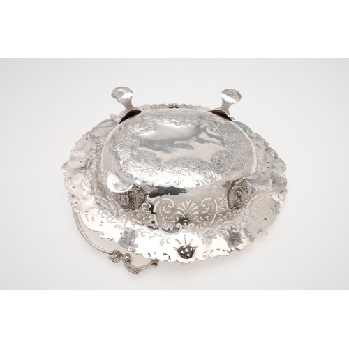 161 - A GEORGE II SWING-HANDLE SILVER CAKE BASKET. with a flat-chased centre, applied floral scroll border... 