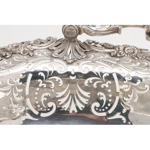 161 - A GEORGE II SWING-HANDLE SILVER CAKE BASKET. with a flat-chased centre, applied floral scroll border... 