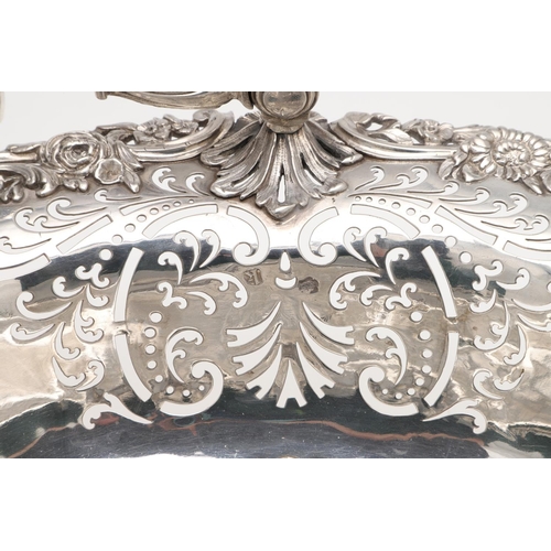 161 - A GEORGE II SWING-HANDLE SILVER CAKE BASKET. with a flat-chased centre, applied floral scroll border... 