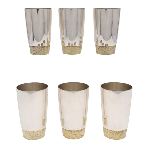 165 - A SET OF SIX ELIZABETH II PARCELGILT TUMBLERS, BY STUART DEVLIN. circular and with textured bases, L... 