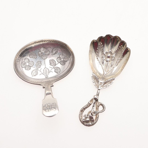 17 - TWO 19TH CENTURY SILVER CADDY SPOONS. a George IV example with a Fiddle stem and a large oval engrav... 