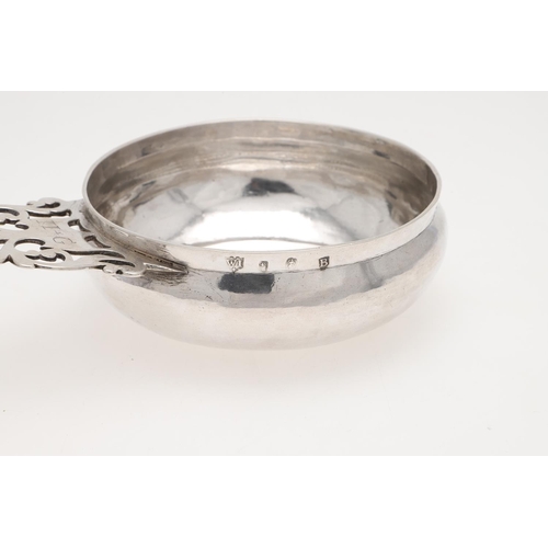 170 - A GEORGE II SILVER BLEEDING BOWL. circular form, the pierced handle initialled 