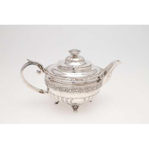 172 - A GEORGE III THREE-PIECE SILVER TEA SET. squat circular form, with gadroon & shell borders, wrythen ... 