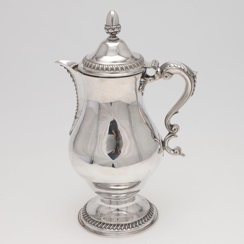 173 - A GEORGE III BALUSTER IRISH SILVER EWER OR JUG. with an acorn finial, a leaf-capped scroll handle an... 