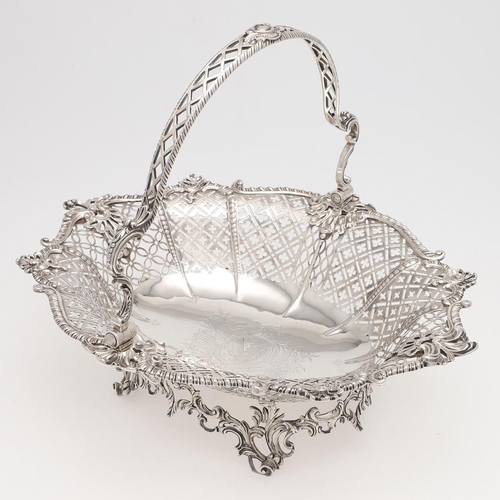 176 - A GEORGE III SWING-HANDLE SILVER CAKE BASKET. shaped oval outline, with a gadrooned border with alte... 