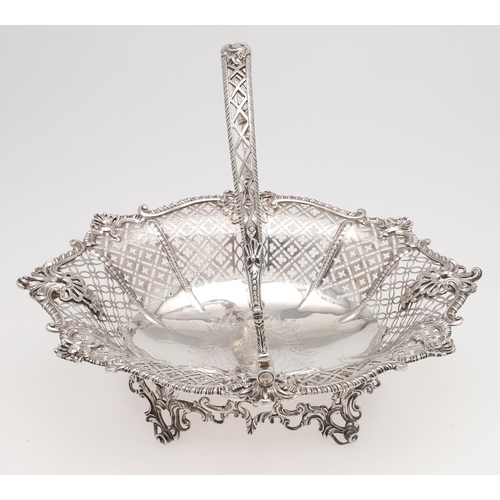 176 - A GEORGE III SWING-HANDLE SILVER CAKE BASKET. shaped oval outline, with a gadrooned border with alte... 