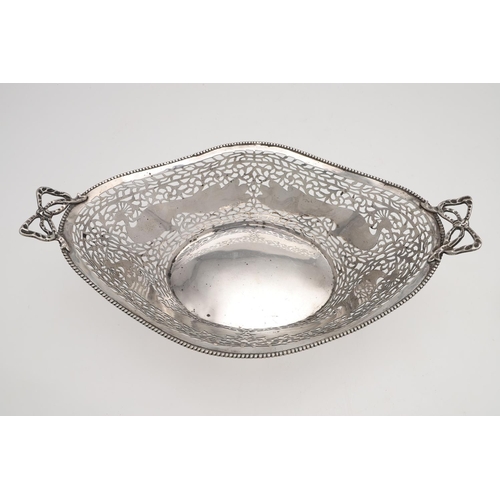 179 - AN EARLY 20TH CENTURY DUTCH SILVER BASKET. shaped oval outline, with twin ribbon-tied handles, bead ... 