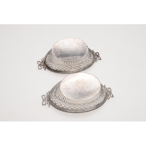 179 - AN EARLY 20TH CENTURY DUTCH SILVER BASKET. shaped oval outline, with twin ribbon-tied handles, bead ... 