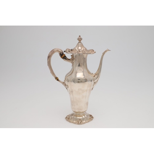 181 - A LATE 19TH/ EARLY 20TH CENTURY NORTH AMERICAN SILVER COFFEE POT. vase-shaped and decorated in the r... 