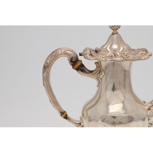 181 - A LATE 19TH/ EARLY 20TH CENTURY NORTH AMERICAN SILVER COFFEE POT. vase-shaped and decorated in the r... 