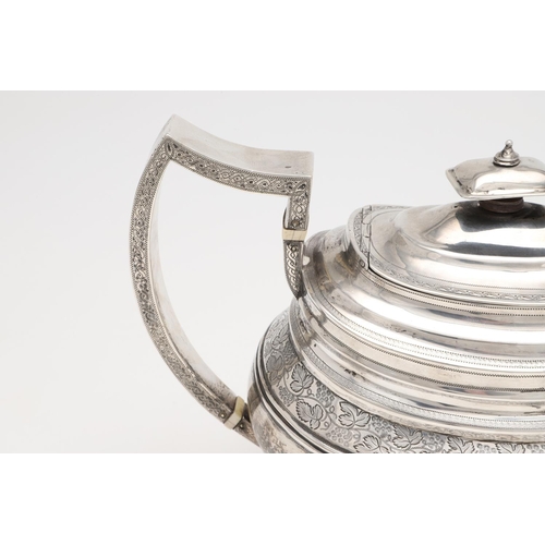 182 - A GEORGE III THREE-PIECE SILVER TEA SET. rounded oblong form, with engraved borders, a central friez... 