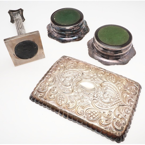 187 - A PAIR OF EARLY 20TH CENTURY SILVER MOUNTED WINE COASTERS. shaped circular outline, with a moulded b... 