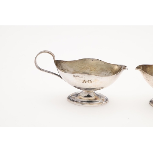 191 - A CASED PAIR OF SILVER SALTS & MATCHING SPOONS. in the form of sauce boats, initialled on one side 