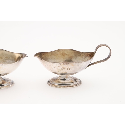 191 - A CASED PAIR OF SILVER SALTS & MATCHING SPOONS. in the form of sauce boats, initialled on one side 