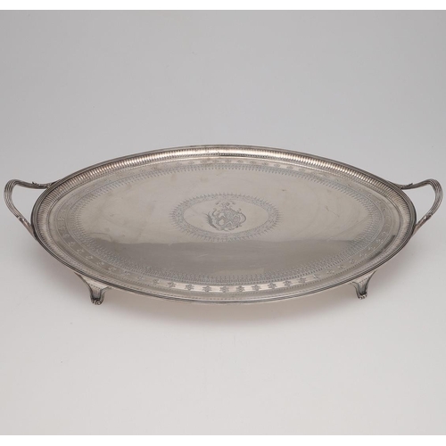 202 - A GEORGE III LARGE BRIGHT-ENGRAVED SILVER TEA TRAY. oval outline, with twin handles, the centre with... 