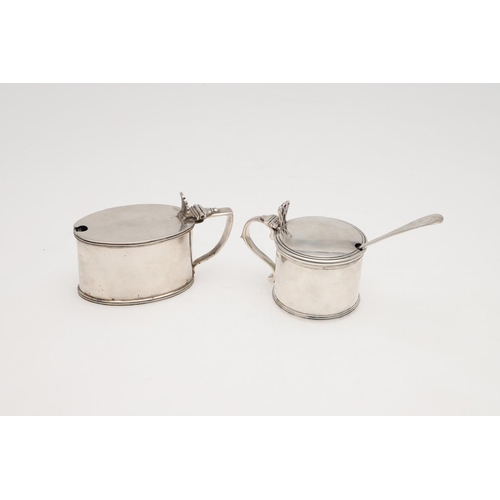 204 - TWO SILVER MUSTARD POTS. a drum-shaped mustard pot with incised borders, by William Comyns & Sons Lt... 