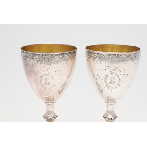 210 - A PAIR OF GEORGE III SILVER WINE GOBLETS, BY HESTER BATEMAN. on square pedestal bases, with bead bor... 