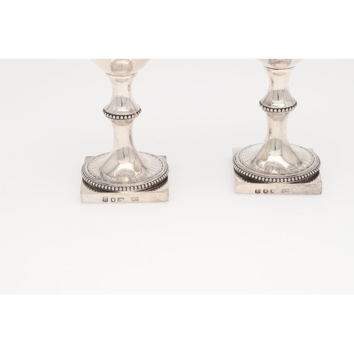 210 - A PAIR OF GEORGE III SILVER WINE GOBLETS, BY HESTER BATEMAN. on square pedestal bases, with bead bor... 