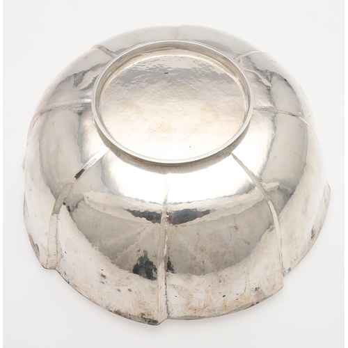 214 - AN EARLY 20TH CENTURY AUSTRIAN SILVER BOWL. shaped circular outline, with a spot hammered finish and... 