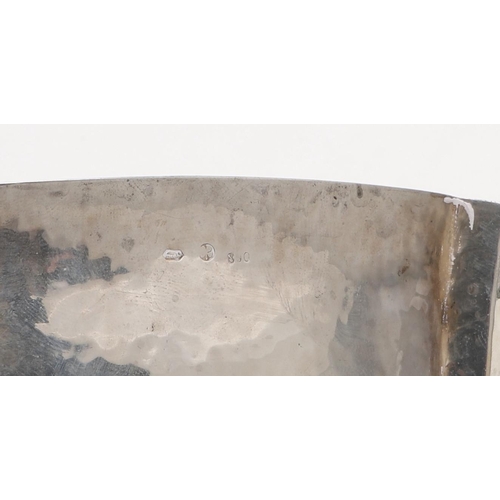 214 - AN EARLY 20TH CENTURY AUSTRIAN SILVER BOWL. shaped circular outline, with a spot hammered finish and... 