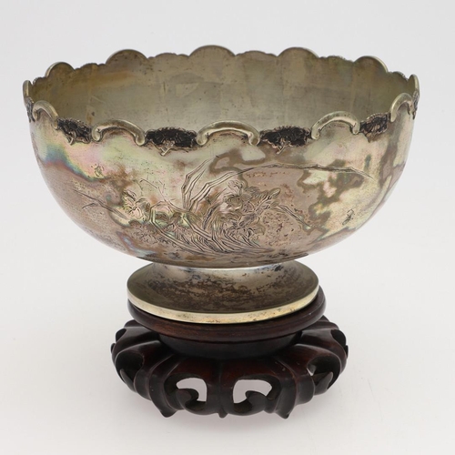 217 - A LATE 19TH/ EARLY 20TH CENTURY CHINESE SILVER ROSE BOWL. of circular outline, with a border of alte... 