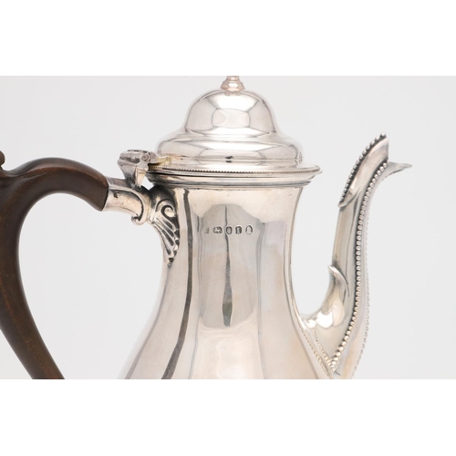 223 - A GEORGE III SILVER COFFEE POT. baluster form, with bead borders, an urn finial and a scroll handle,... 