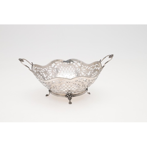 225 - A MODERN DUTCH SILVER BASKET. shaped circular outline, with bead borders and twin scroll handles, Go... 