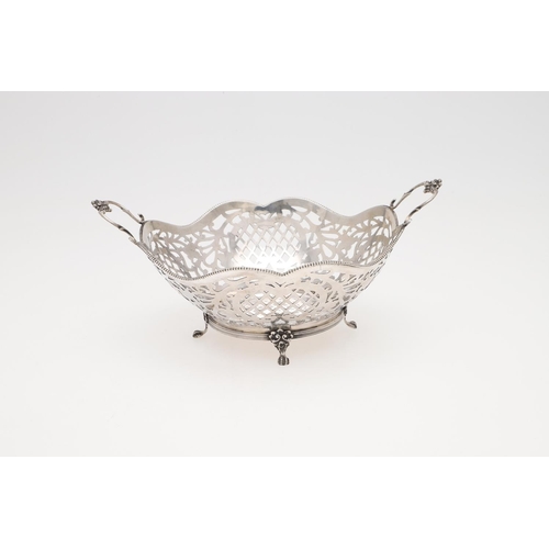 225 - A MODERN DUTCH SILVER BASKET. shaped circular outline, with bead borders and twin scroll handles, Go... 