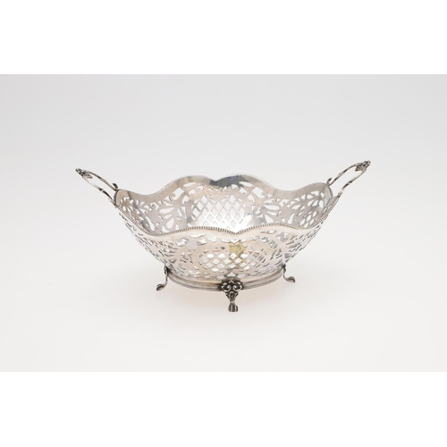 225 - A MODERN DUTCH SILVER BASKET. shaped circular outline, with bead borders and twin scroll handles, Go... 