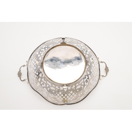 225 - A MODERN DUTCH SILVER BASKET. shaped circular outline, with bead borders and twin scroll handles, Go... 