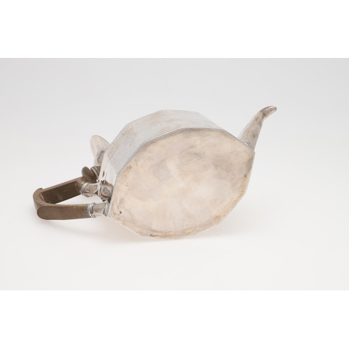 228 - A GEORGE V SILVER TEA POT. shaped decagon outline, with bright-cut borders and a wooden handle & fin... 